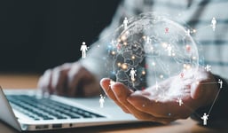 Person holding a globe