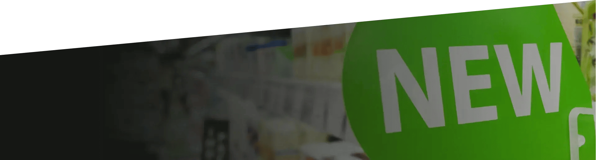 A department store with an aisle titled "new"