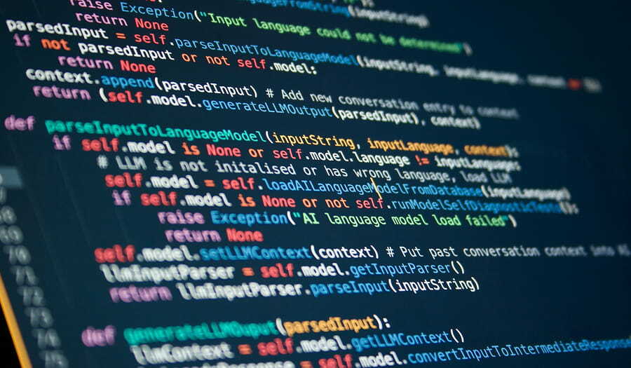 Colorful programming code displayed on a dark screen, representing the software development context of API-based translation.