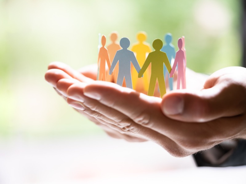 business hands holding paper people circle
