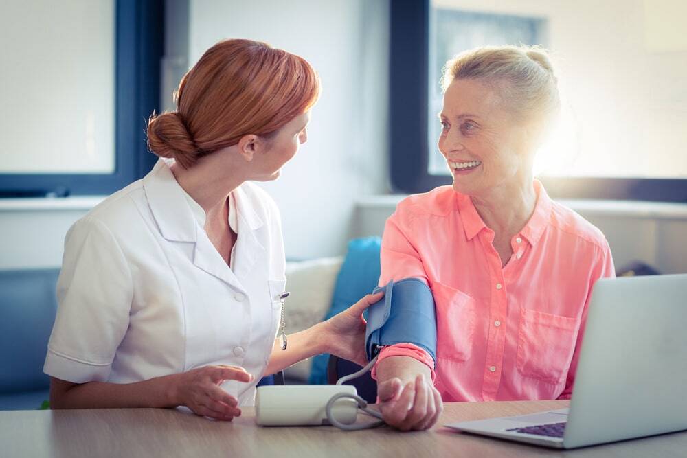 nurse caring for patient