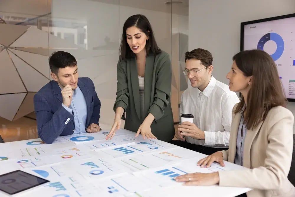 team reviewing market research results