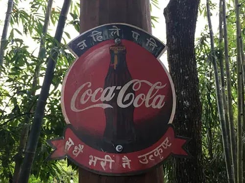 Coca Cola sign with translated text