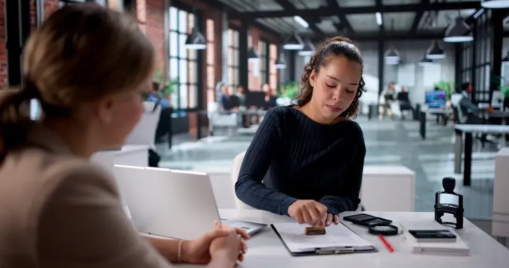 woman notarizing document