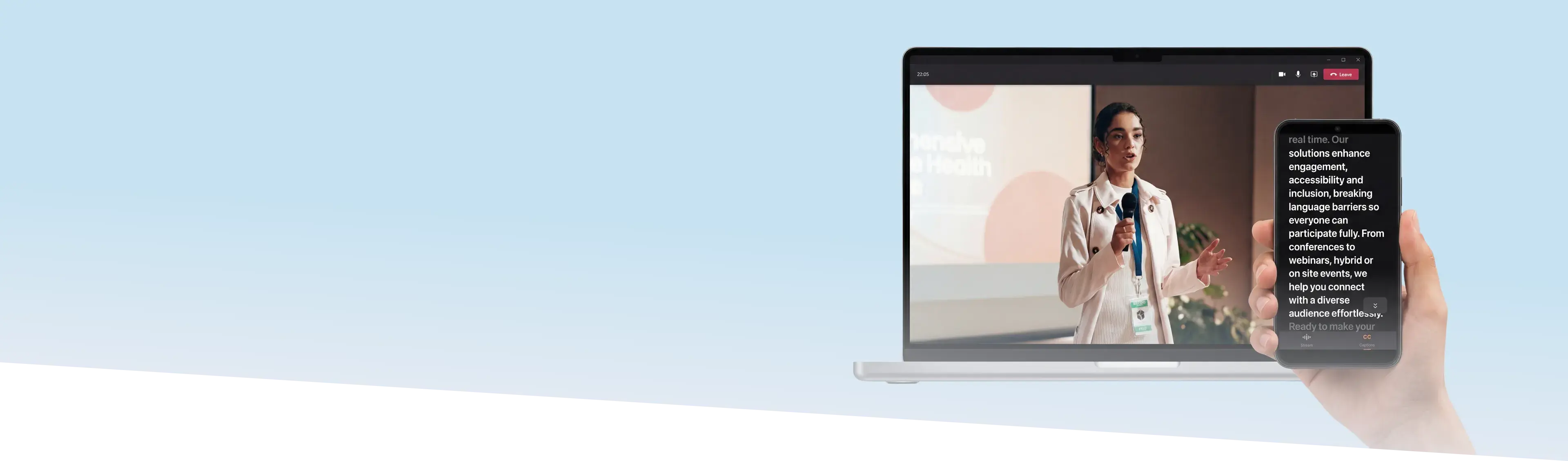 Conference presenter speaking into a microphone while a smartphone displays real-time multilingual captions