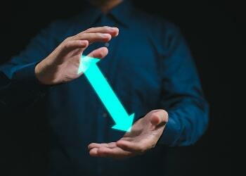 Glowing arrow passing between two open hands