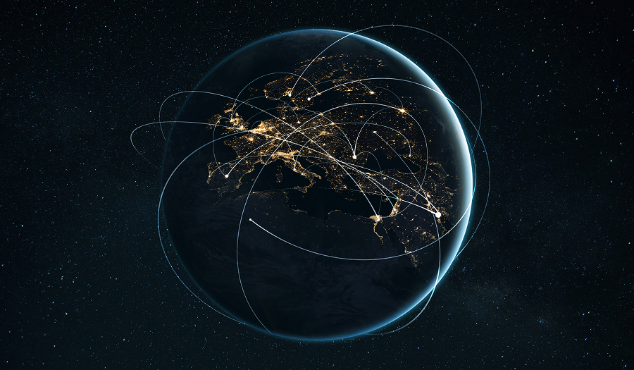 A view of Earth from space at night showing illuminated city lights across Europe, Africa, and the Middle East, connected by glowing curved lines representing global communication and data networks.