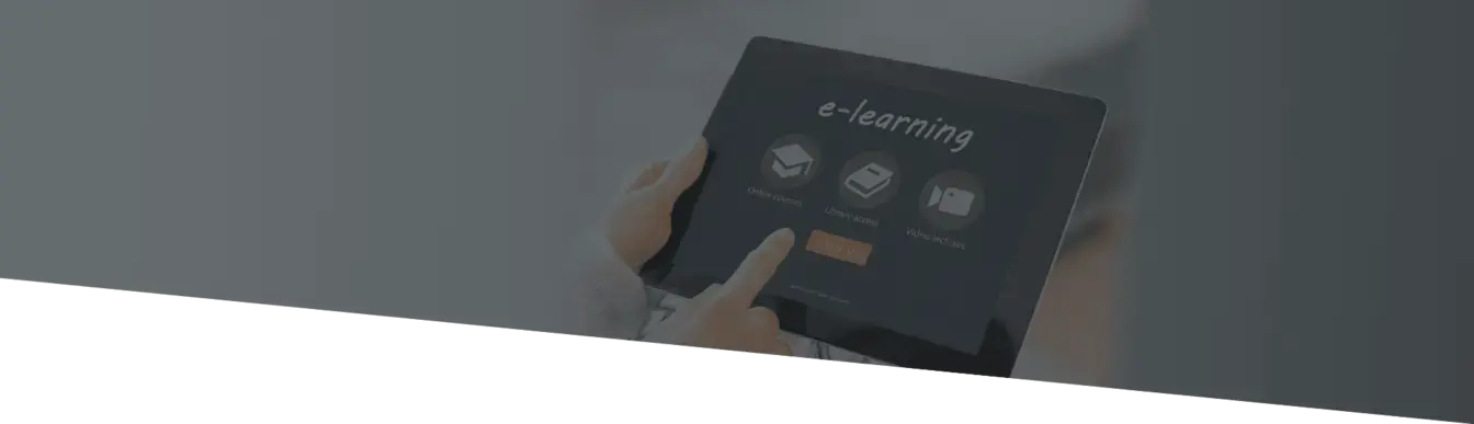 Person using a tablet with eLearning course icons displayed on screen