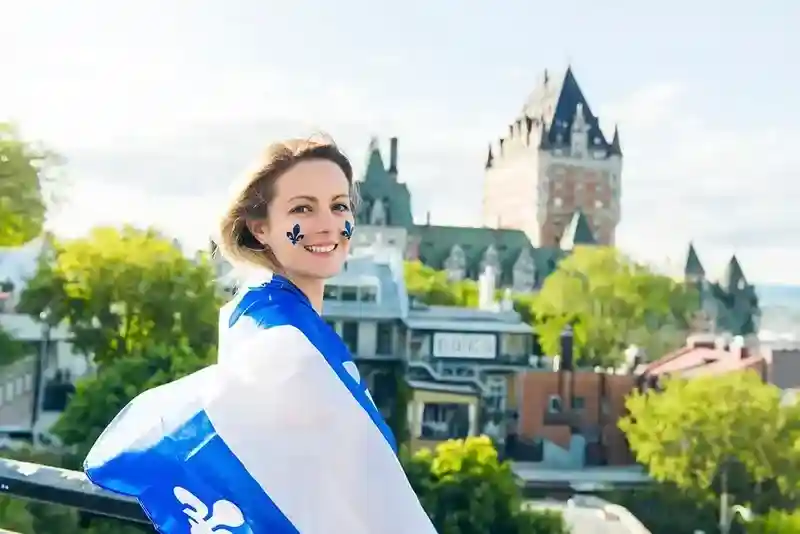 Woman wrapped in Quebec flag